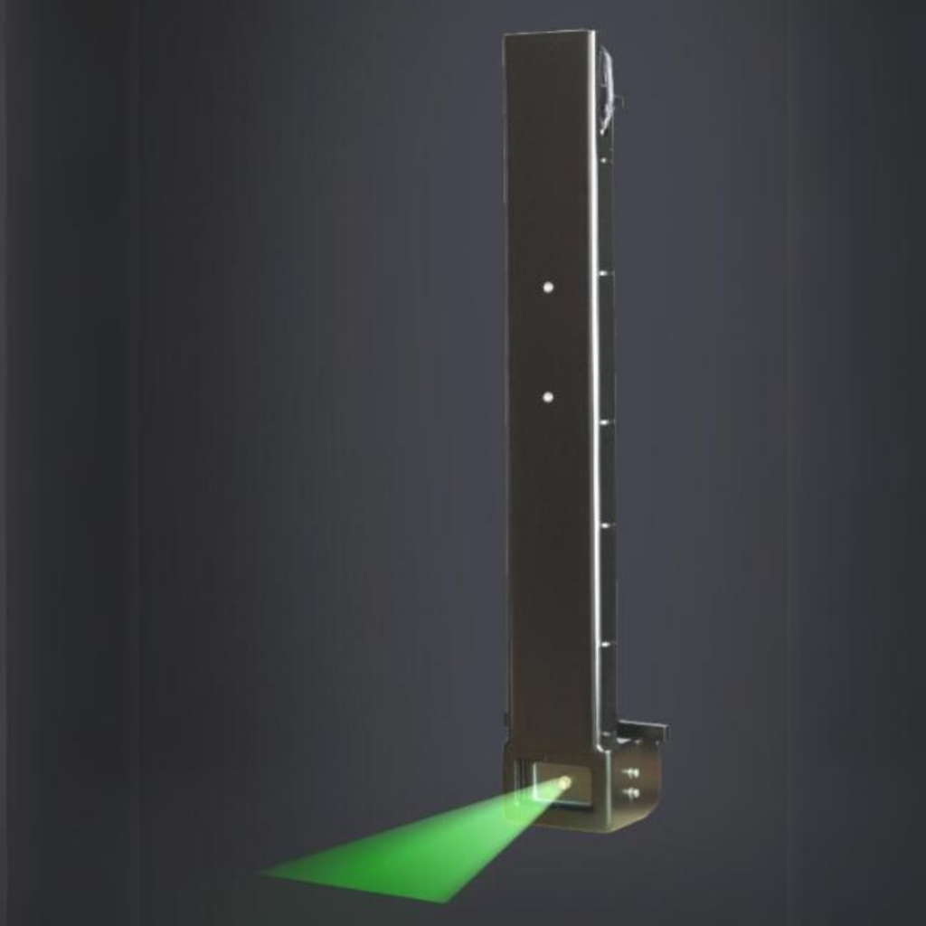 Integra laser shining green laser with a black background
